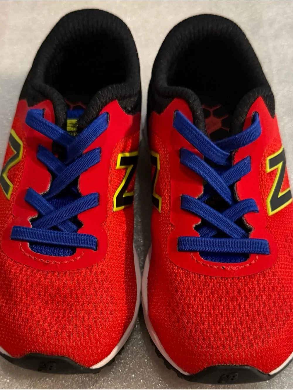 New Balance Red Kids Sneakers with Blue Laces